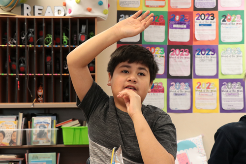 A student raises their hand